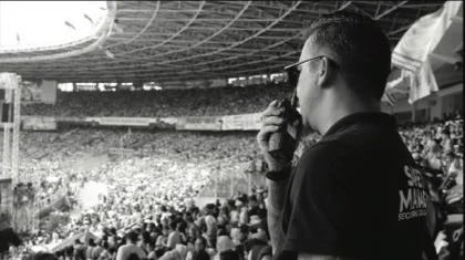 Safety personnel overseeing the audience at GBK Main Stadium